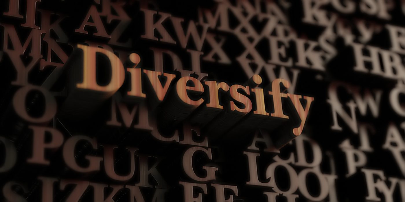 diversify - Wooden 3D rendered letters/message.  Can be used for an online banner ad or a print postcard.